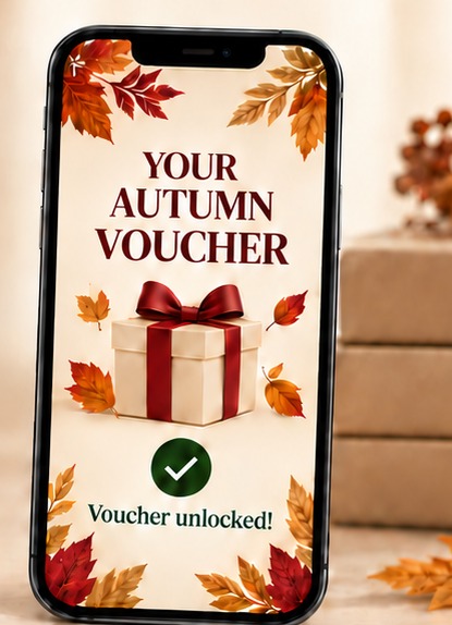 Digital autumn voucher on a phone beside an acrylic QR stand